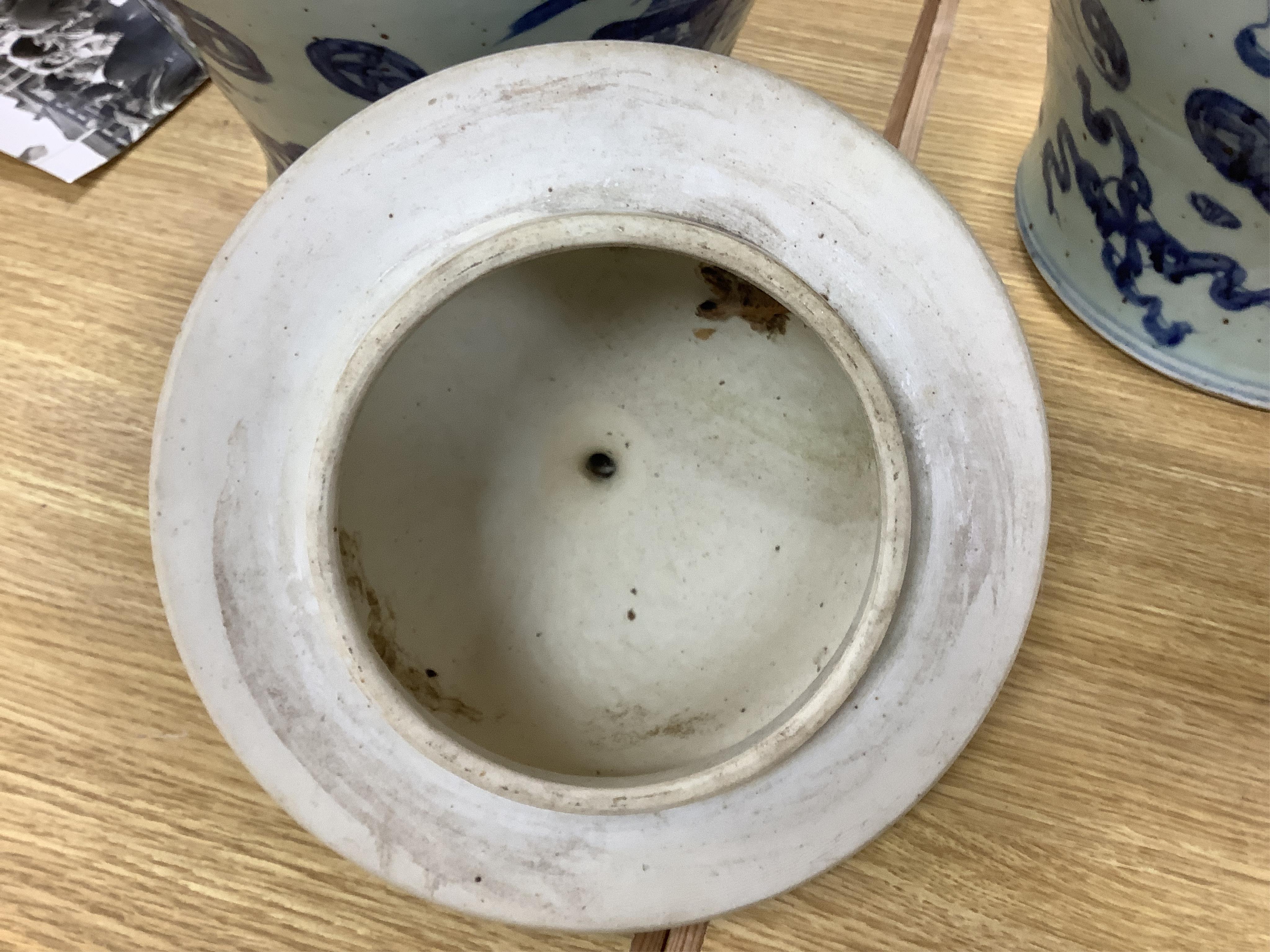 A large pair of Chinese blue and white ginger jars and covers, 54cm high. Condition - fair to good